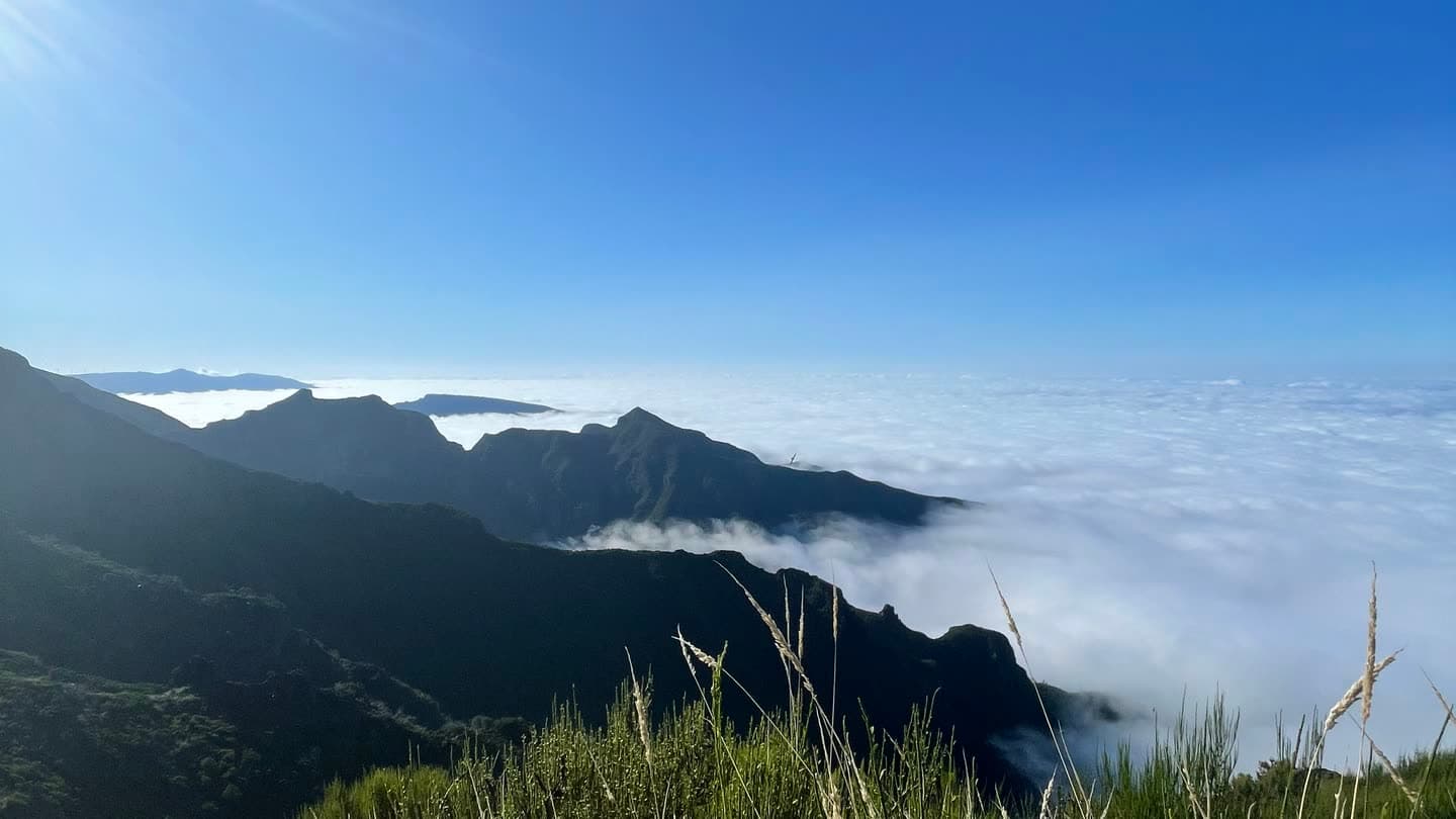 A mountain ridge in Madeira standing above an unbroken layer of cloud